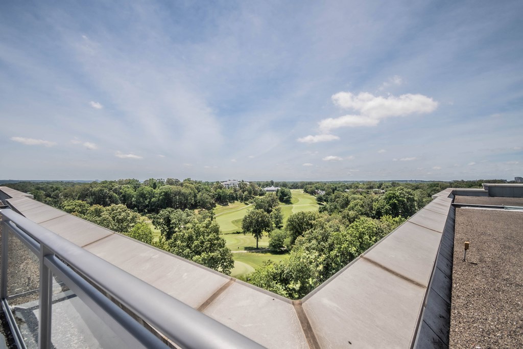 a view of the golf course from the roof of a building