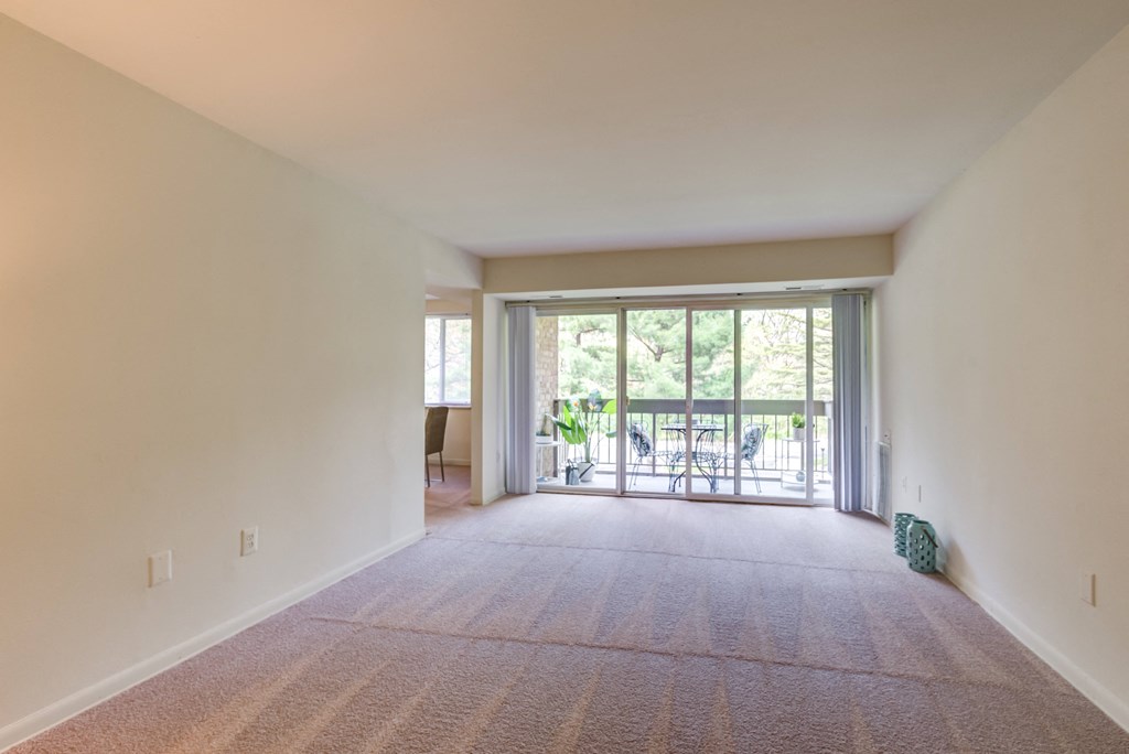 living room and a walk out private balcony