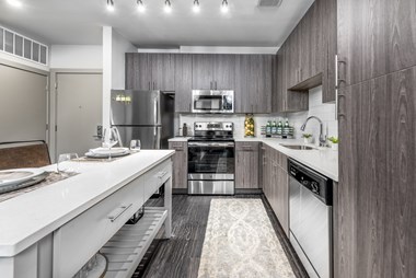 The Edition unit kitchen with stainless steel appliances