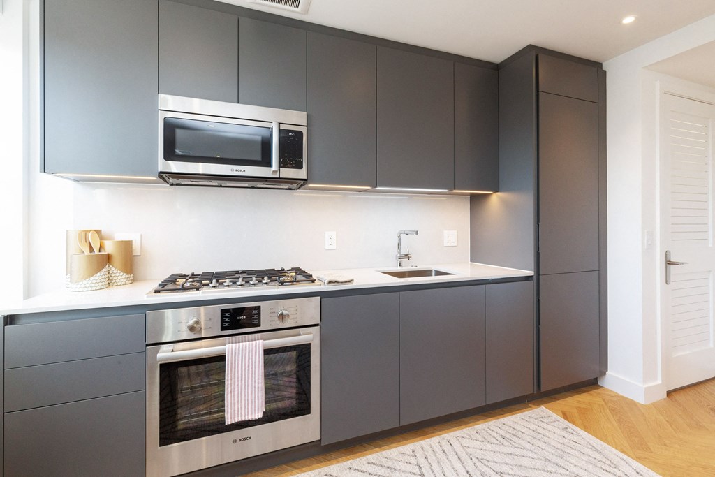 The Stanton studio apartment kitchen with quartz countertops