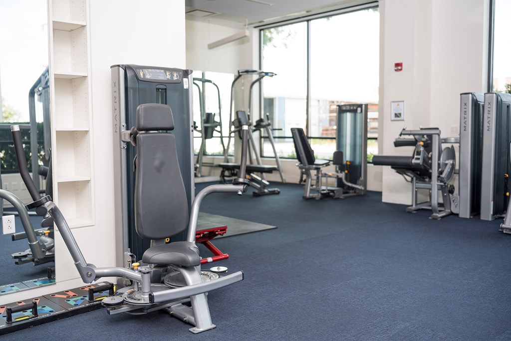 a gym with cardio machines and other exercise equipment