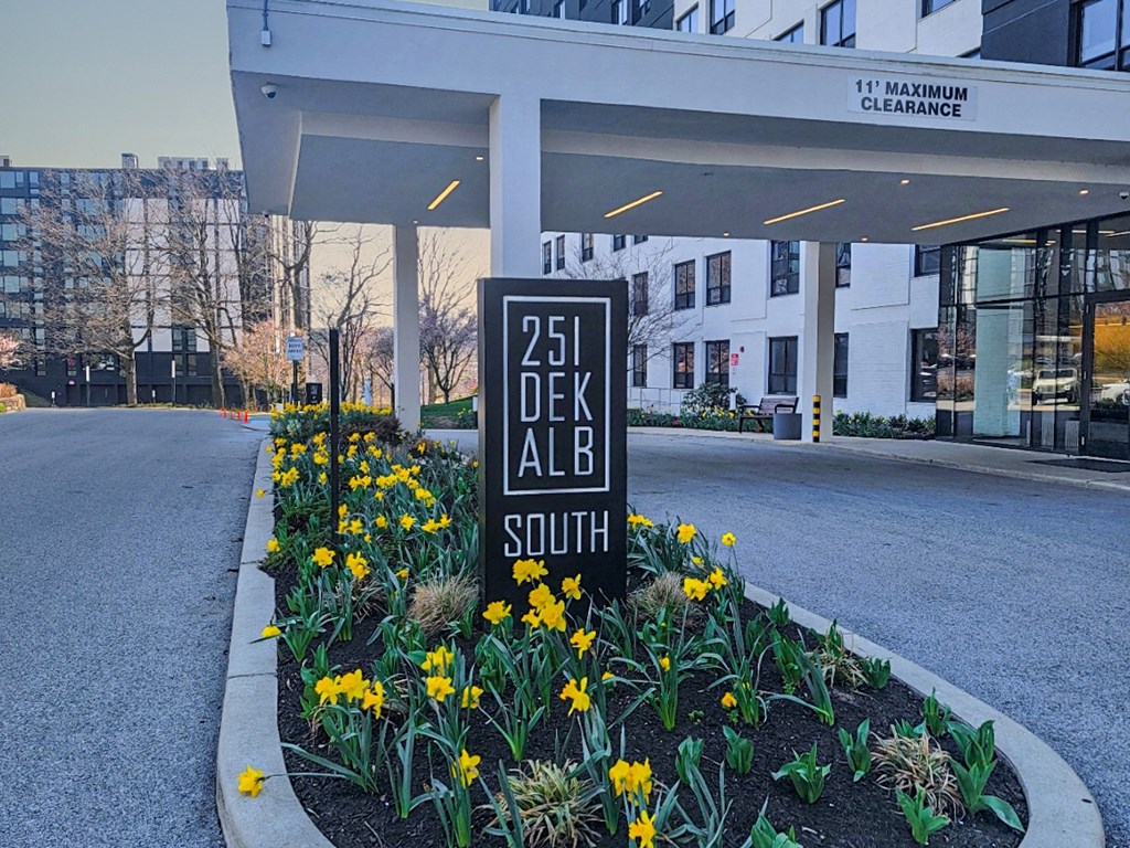 a sign in front of a building that reads 25 dekalb south