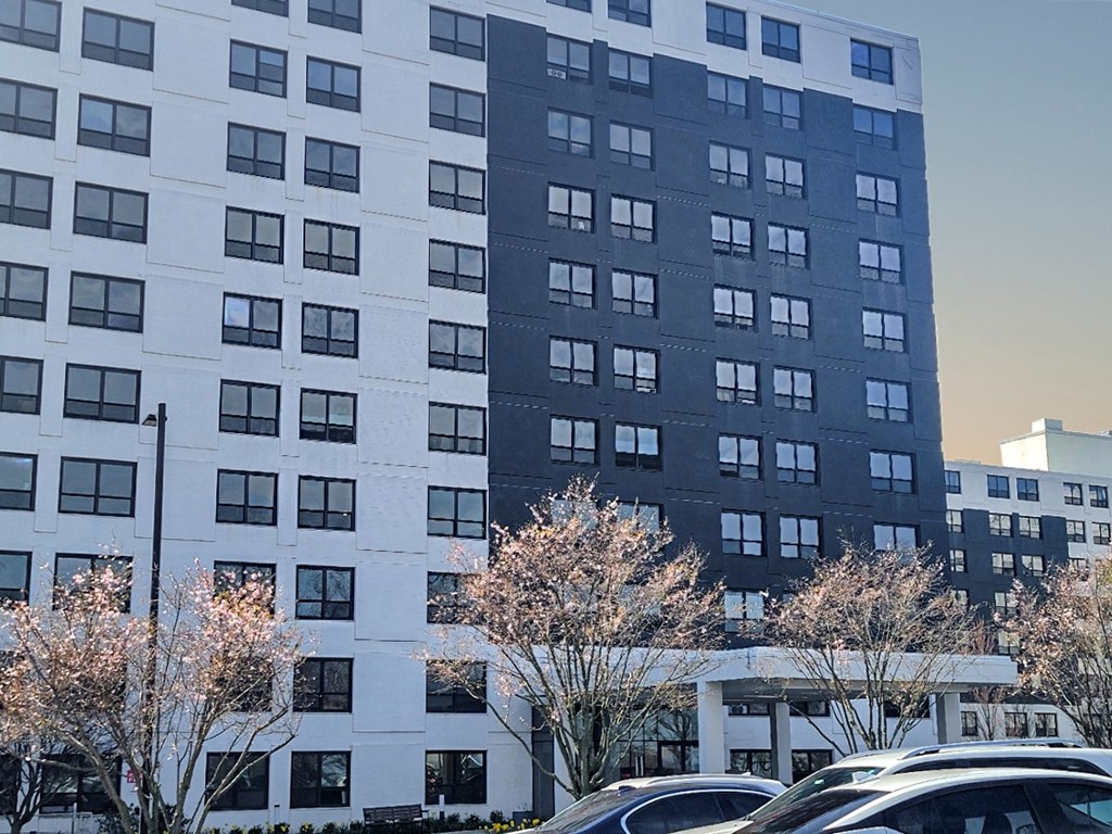 a large building with a parking lot in front of it