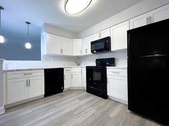 Modern, white kitchen with quartz countertop