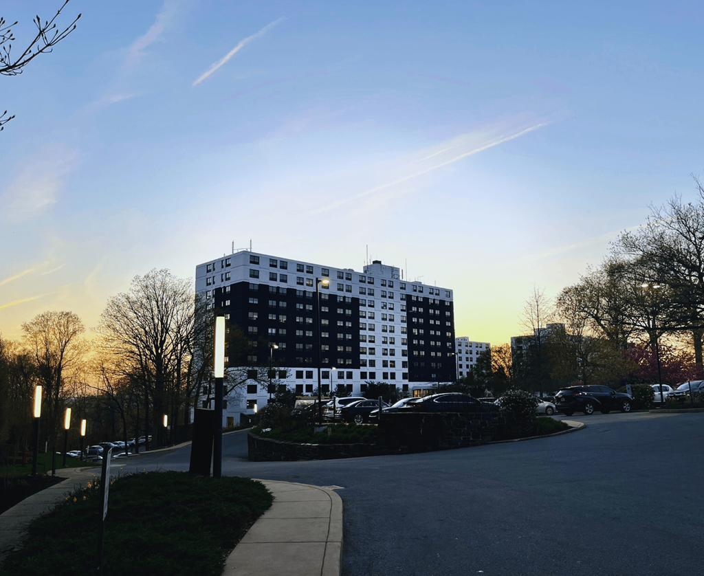 a building in the distance with a street in front of it