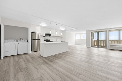 a kitchen and living room in a 555 waverly unit