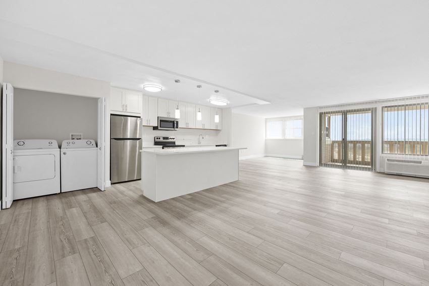 a kitchen and living room in a 555 waverly unit