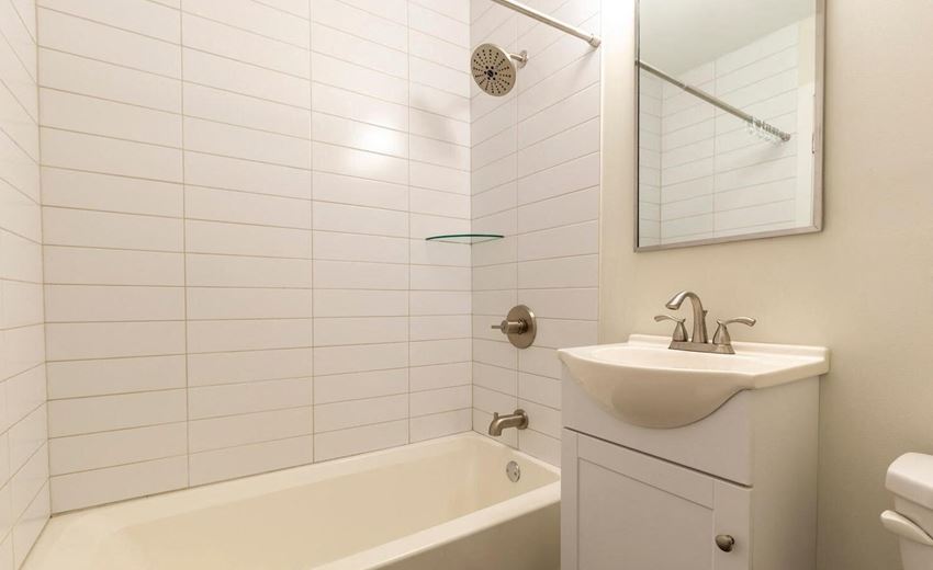 Bathroom with updated vanity and white subway tiles Bathroom with updated vanity and white subway tiles