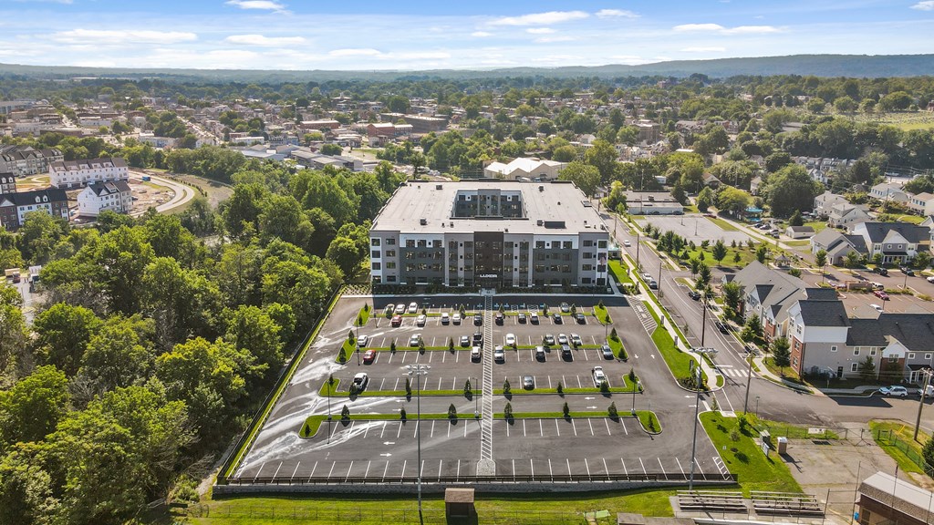 A large building with a parking lot in front of it.