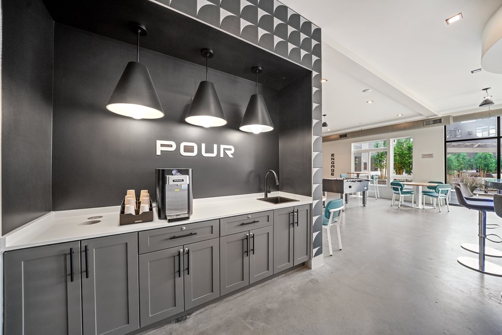 A kitchen with a counter and a sign that says Pour.