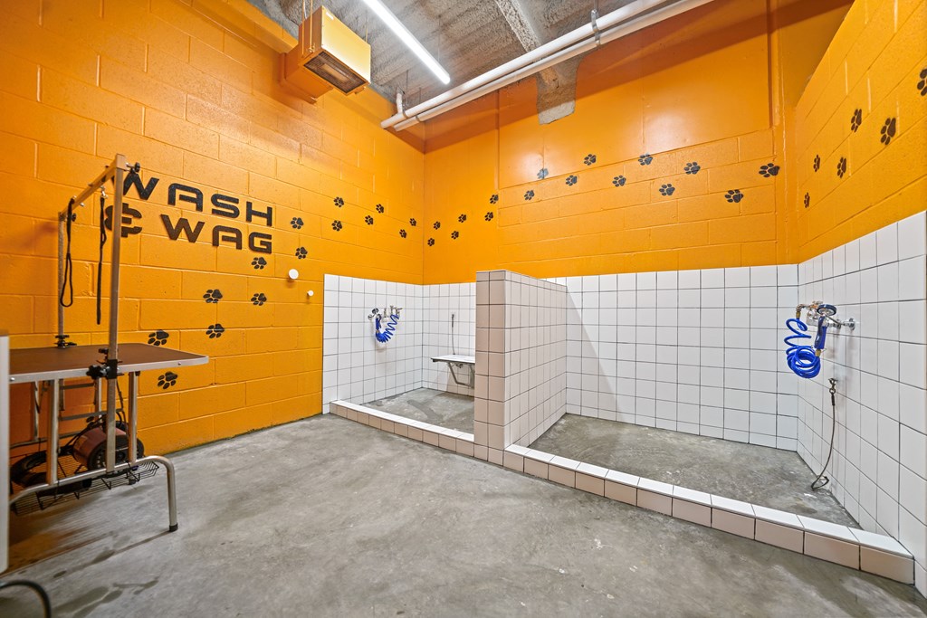 A bathroom with orange walls and a sign that says "Wash Wag".