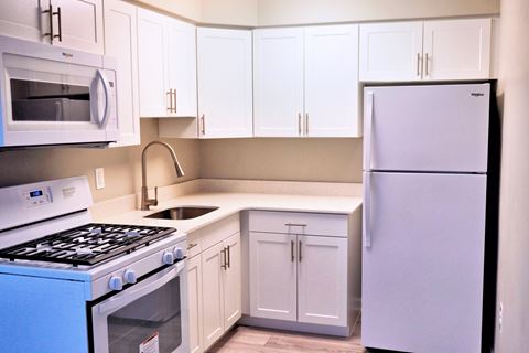 Updated white kitchen with quartz countertop