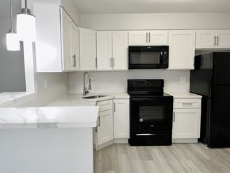 Modern, white kitchen with quartz countertop