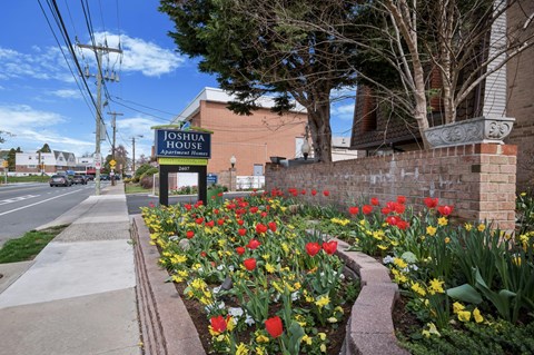 Joshua House is a building with a sign in front of it.