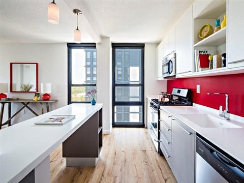 kitchen with modern appliances and quartz countertop
