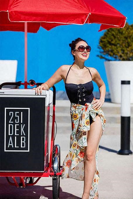 A young lady posing outside