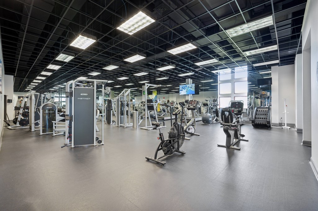 A spacious gym with a variety of exercise equipment.