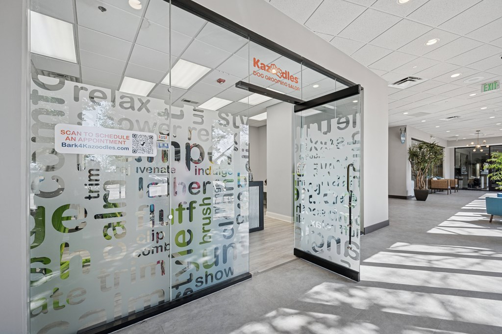 A glass wall with words written on it and a sign that says Karlie's.