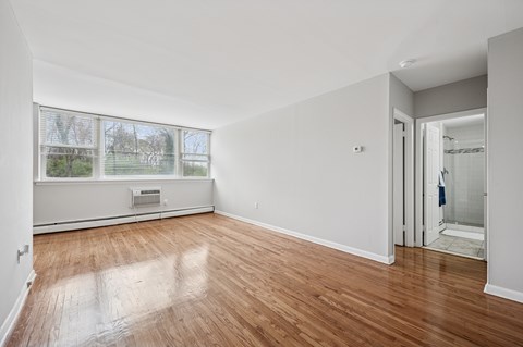 A room with a window and a door.