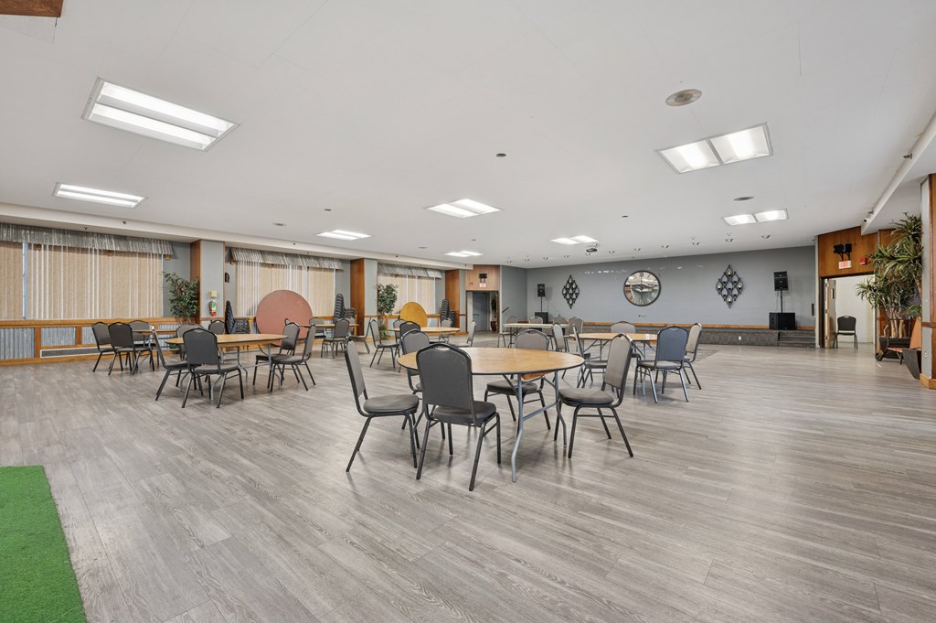 A conference room with a long table and chairs.