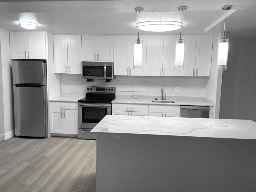 Modern White Kitchen With A Quartz Countertop Modern White Kitchen With A Quartz Countertop