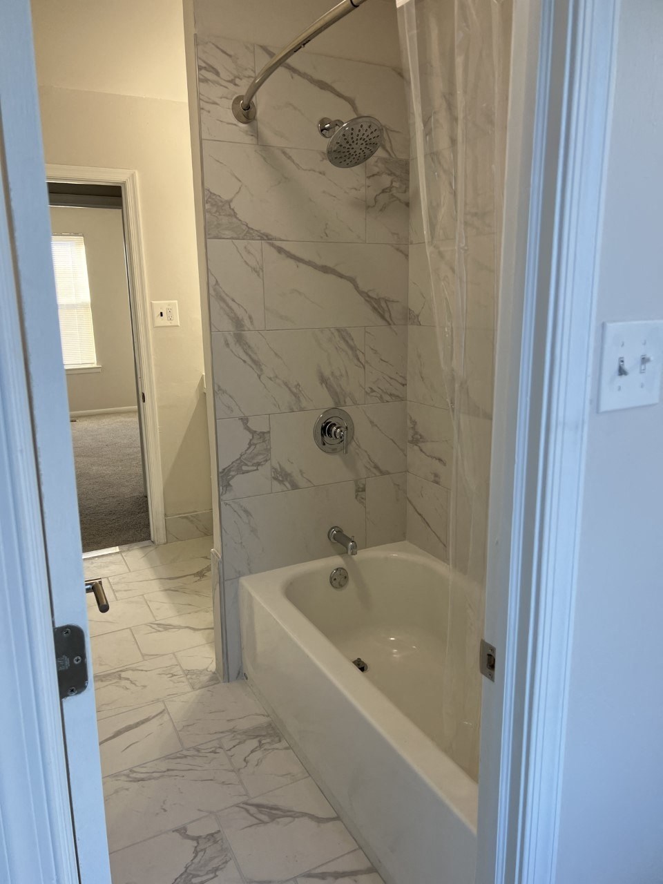 Marbled shower and bathtub