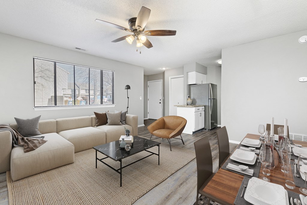 Living room and dining room view with furniture at Eddingham in Lawrence, KS