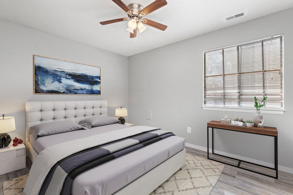 Bedroom with window, bed, and table at Eddingham in Lawrence, KS