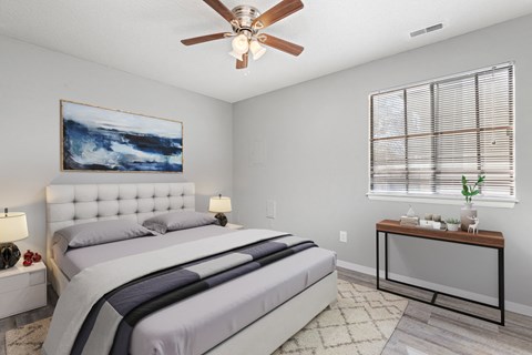 Bedroom with window, bed, and table at Eddingham in Lawrence, KS