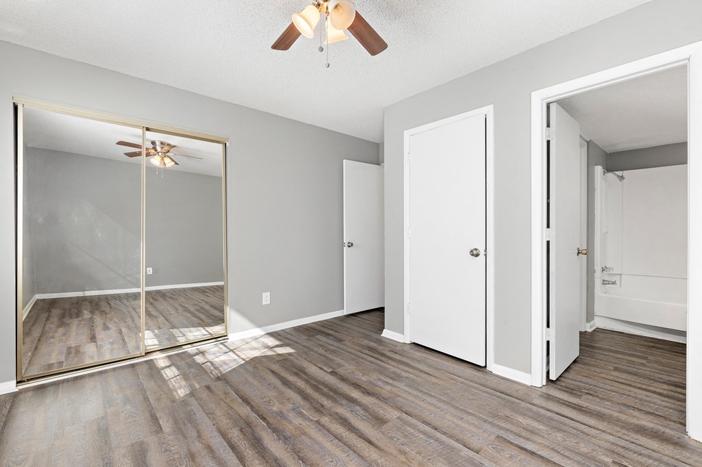 Bedroom with closet doors at Eddingham in Lawrence, KS