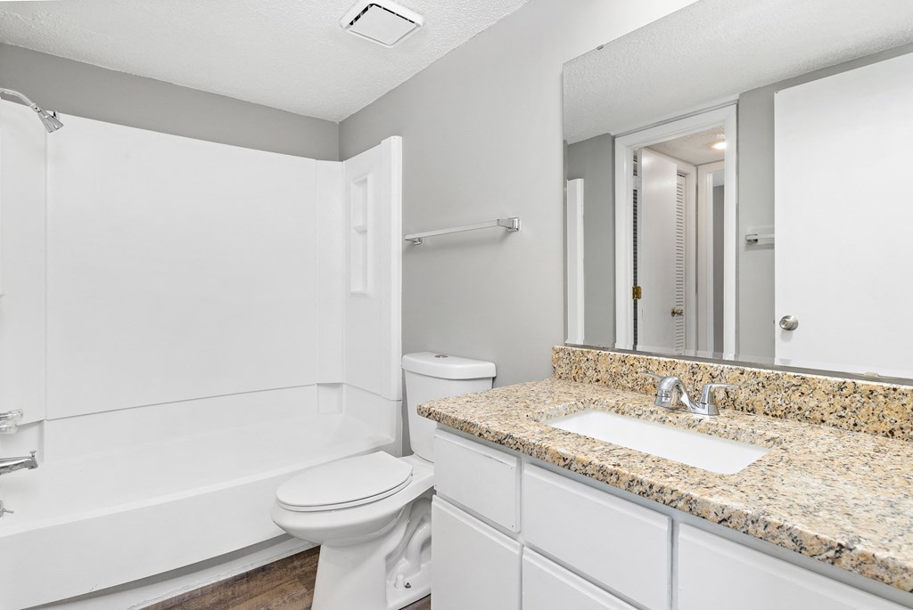 Bathroom with shower, toilet, and vanity at Eddingham in Lawrence, KS