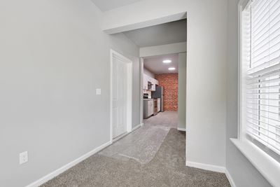 Photo of entrance into kitchen with new carpet