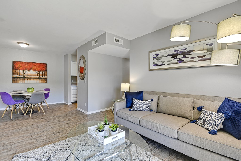 living room with hardwood floor with dining room