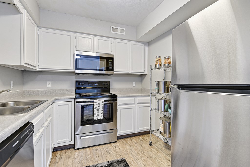 fully eqquiped kitchen with stainless steel appliances at fairway hills apartments