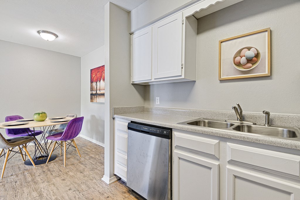 white cabinetry with dishwasher at fairway hills apartments