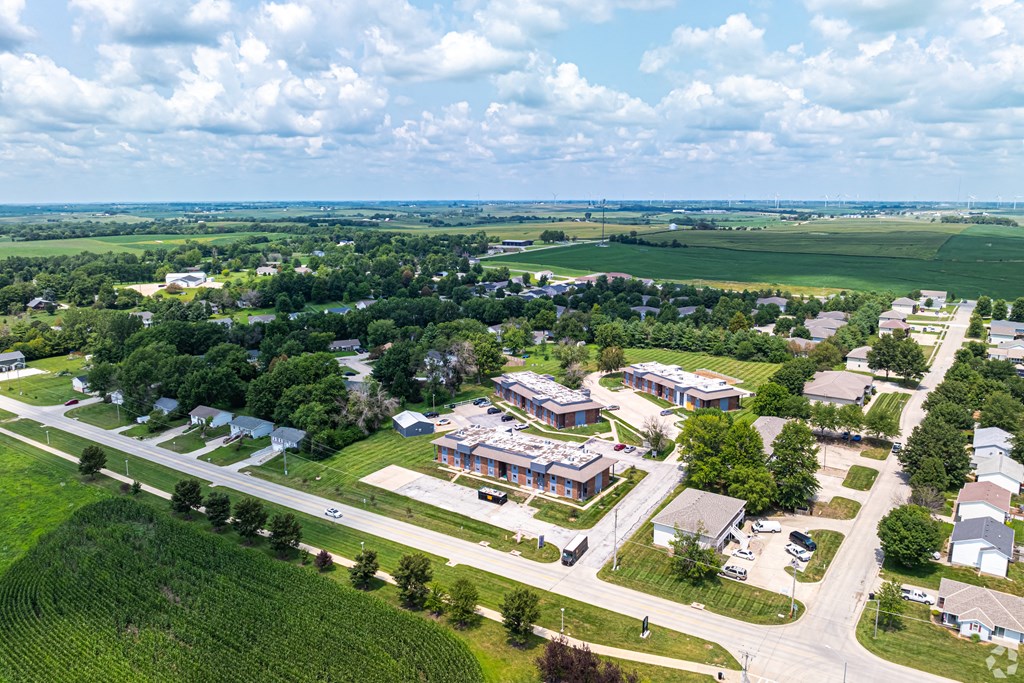 an aerial view of a city with buildings and a road