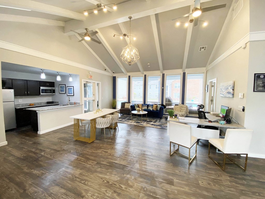 a living room with a kitchen and a dining room