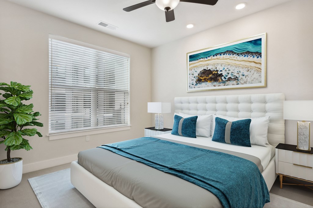 a bedroom with a bed and a ceiling fan