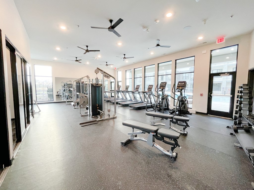 the gym at the district flats apartments in lenexa