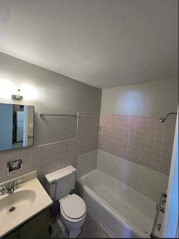 a bathroom with a toilet sink and bathtub