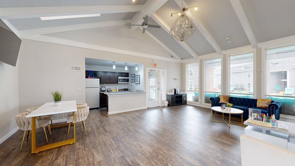 a room with a table and chairs and a kitchen in the background at Bennett Ridge Apartments, Oklahoma City, Oklahoma