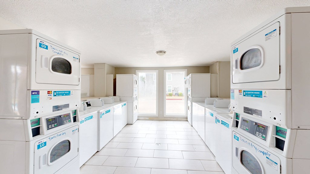 a laundry room with white washers and dryers at Bennett Ridge Apartments, Oklahoma City, 73132