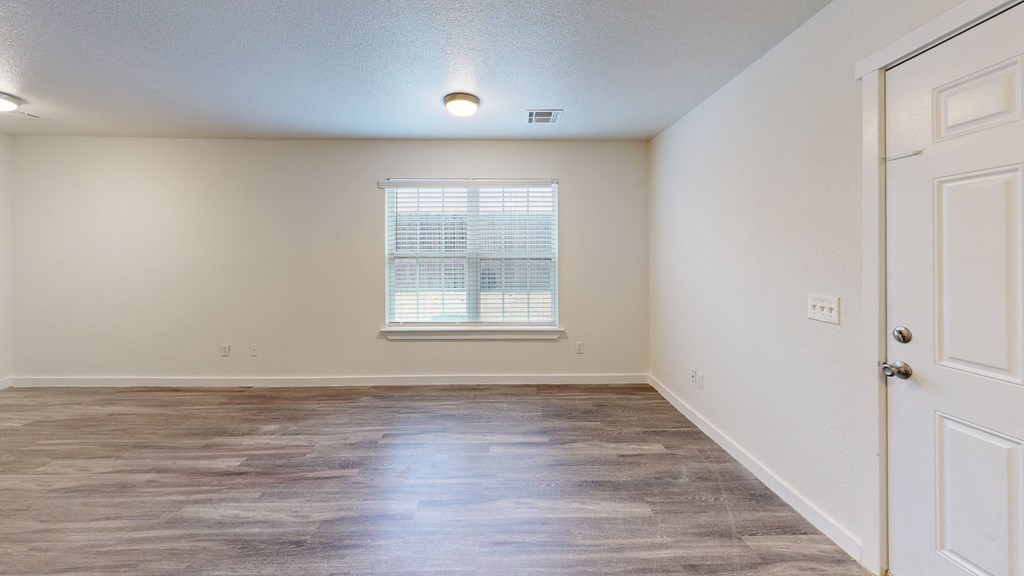 a bedroom with hardwood flooring and a window at Bennett Ridge Apartments, Oklahoma City, 73132
