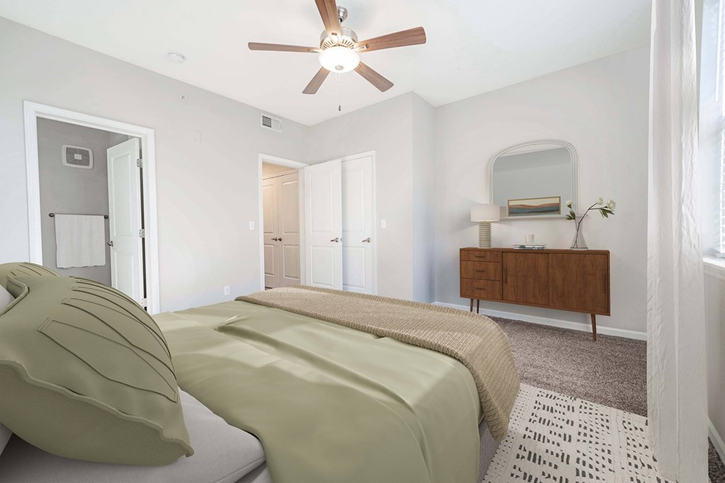 bedroom with bed and tv stand