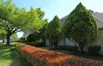 Exterior image of clubhouse with landscaping
