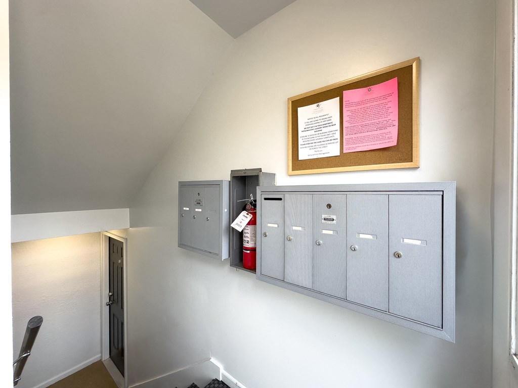 a view of the lockers and a fire extinguisher on the wall of a
