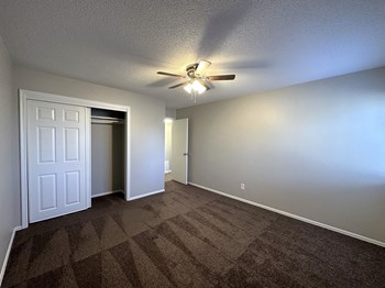 Large bedroom with closet and medium window at the 1 twenty two at 63rd apartments - Photo Gallery 6