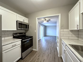 Updated kitchen with open dining area  the 1 twenty two at 63rd apartments - Photo Gallery 3