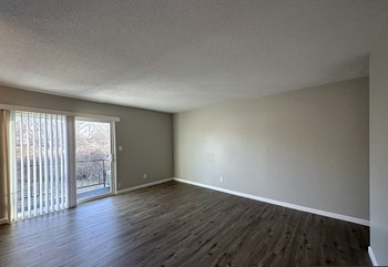 Spacious living room with patio the 1 twenty two at 63rd apartments - Photo Gallery 4