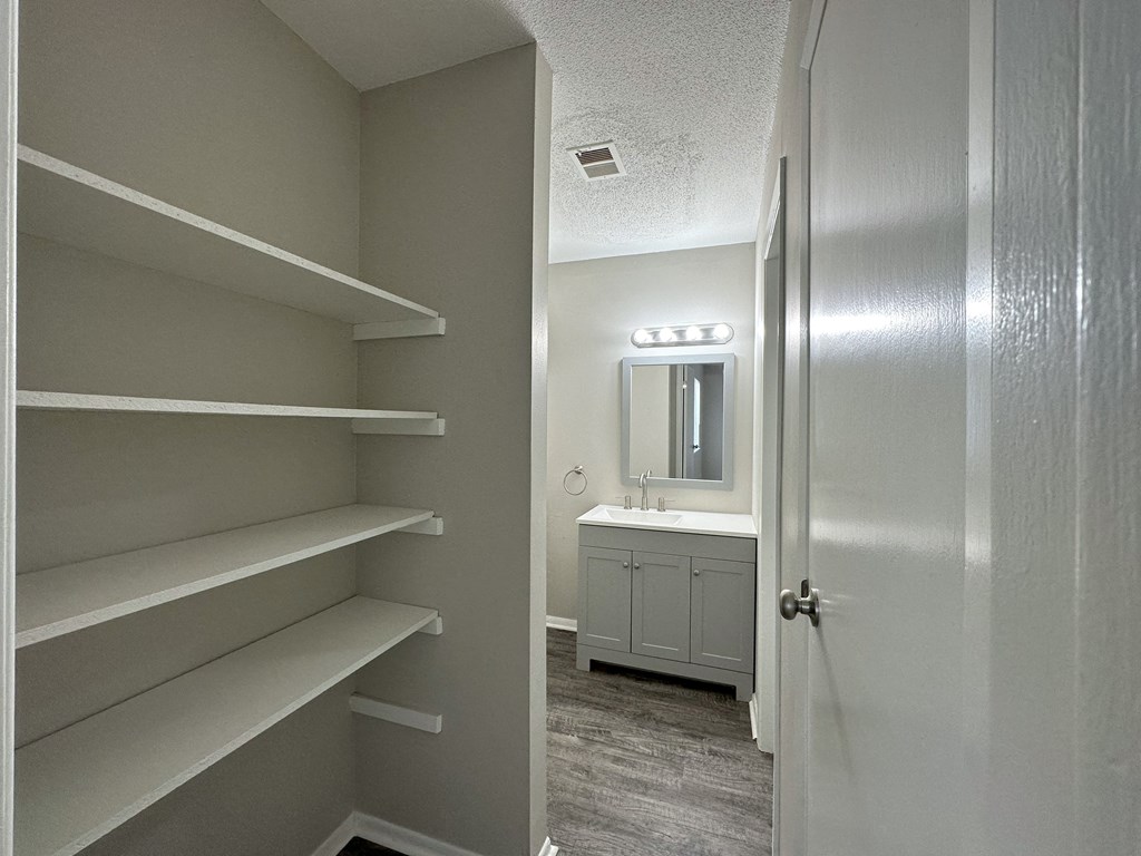 a walk in closet in a 555 waverly unit